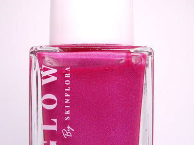 LumiGlow Body Highlighter bottle with radiant pink glow formula