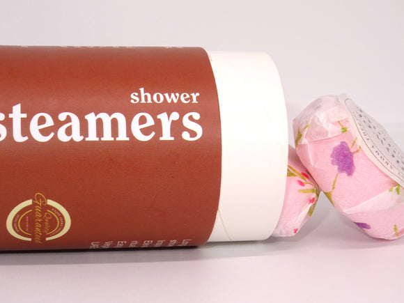 Shower steamers displayed with SkinFlora packaging