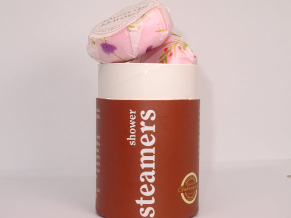 Shower steamers inside SkinFlora container