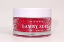 Bamby Soft Lip Scrub jar styled on soft fabric
