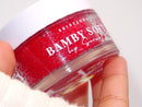 Bamby Soft Lip Scrub jar held in hand