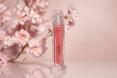 Renew Lip Gloss displayed in floral styled setting