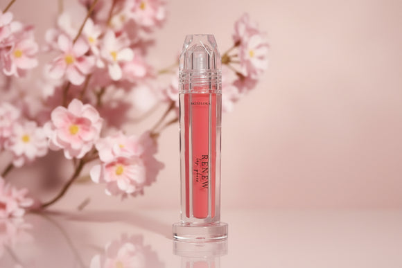 Renew Lip Gloss displayed in floral styled setting