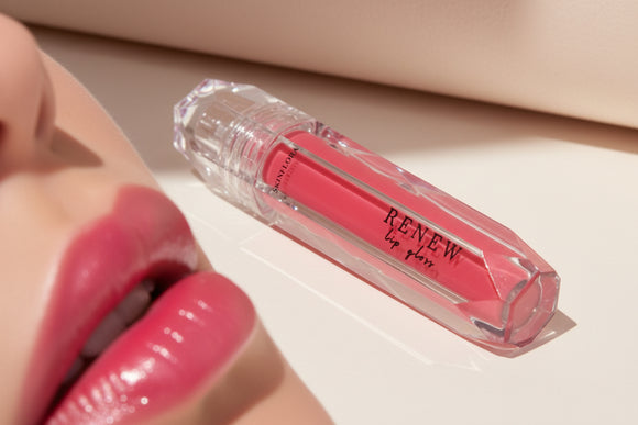 Renew Lip Gloss tube close up showing shine and color