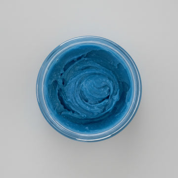Nila Rice Glow body scrub blue texture inside open jar