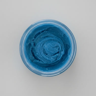 Nila Rice Glow body scrub blue texture inside open jar