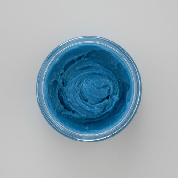 Nila Rice Glow body scrub blue texture inside open jar